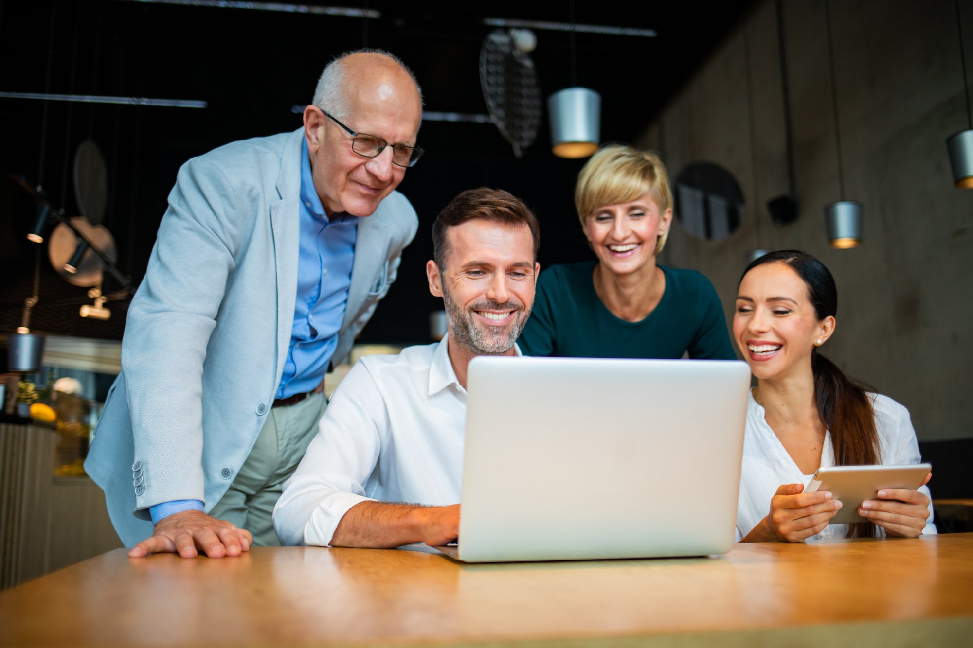 business-people-looking-at-laptop-at-cafe-and-disc-2023-11-27-05-09-45-utc
