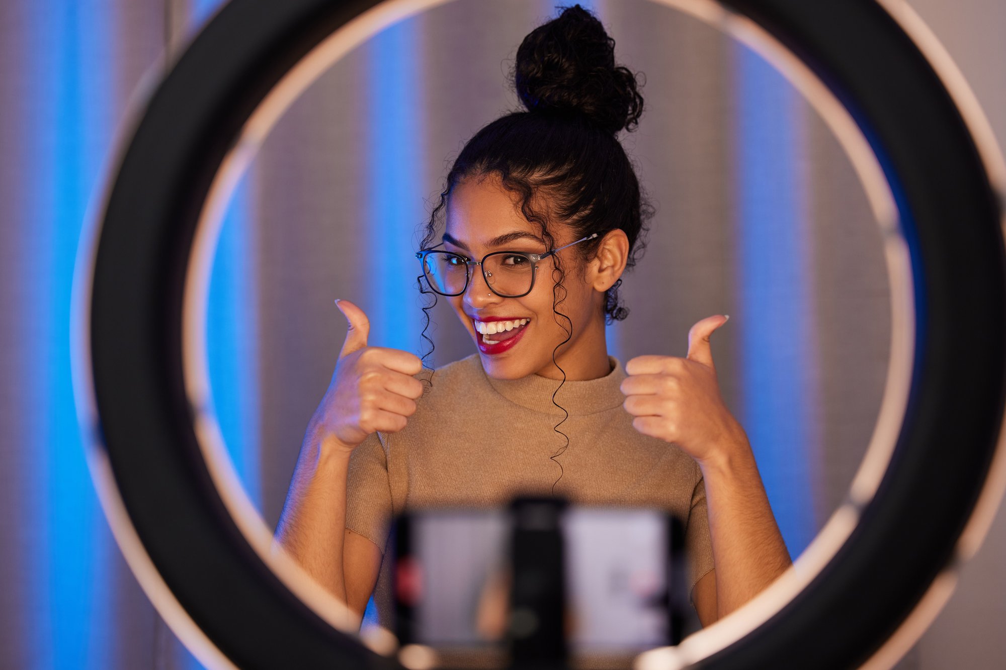 shot-of-a-young-woman-showing-a-thumbs-up-while-us-2023-11-27-05-23-57-utc